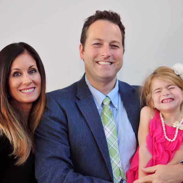 Nicole Ponder and her family smiling together for a family picture