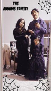 Family dress up as Gomez, Morticia, and Wednesday Addams