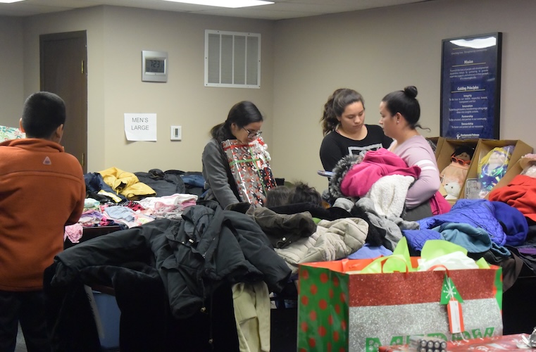 Teens picking out holiday gifts and winter jackets