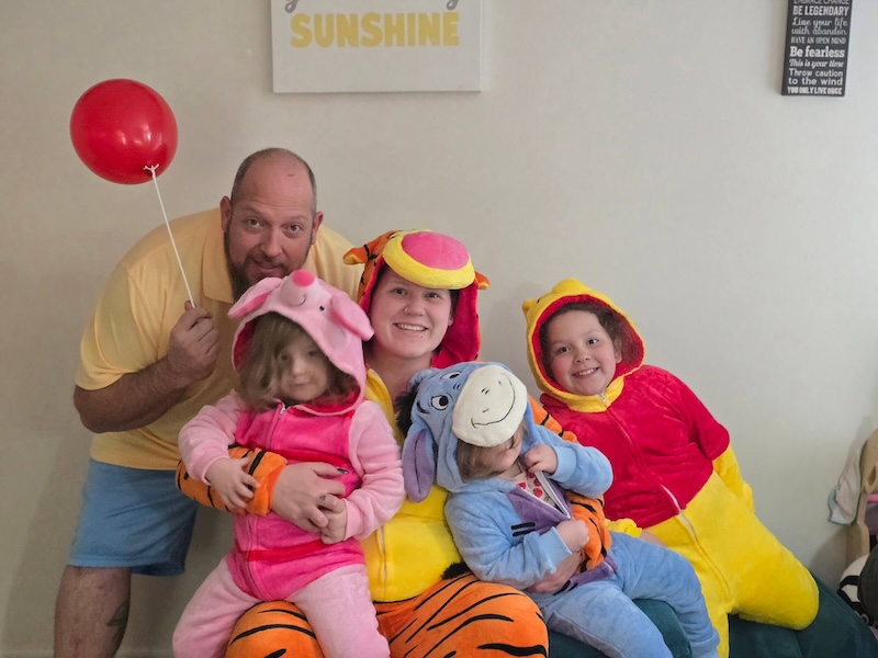 Brother and sister dressed as Mr. and Mrs. Claus