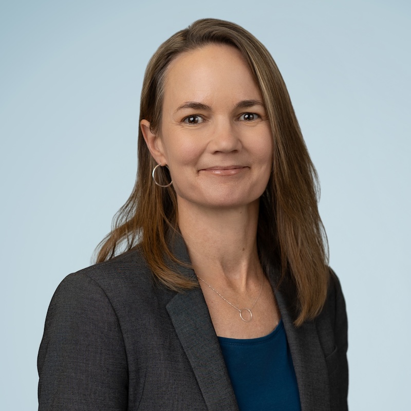 Woman in brown hair grinning