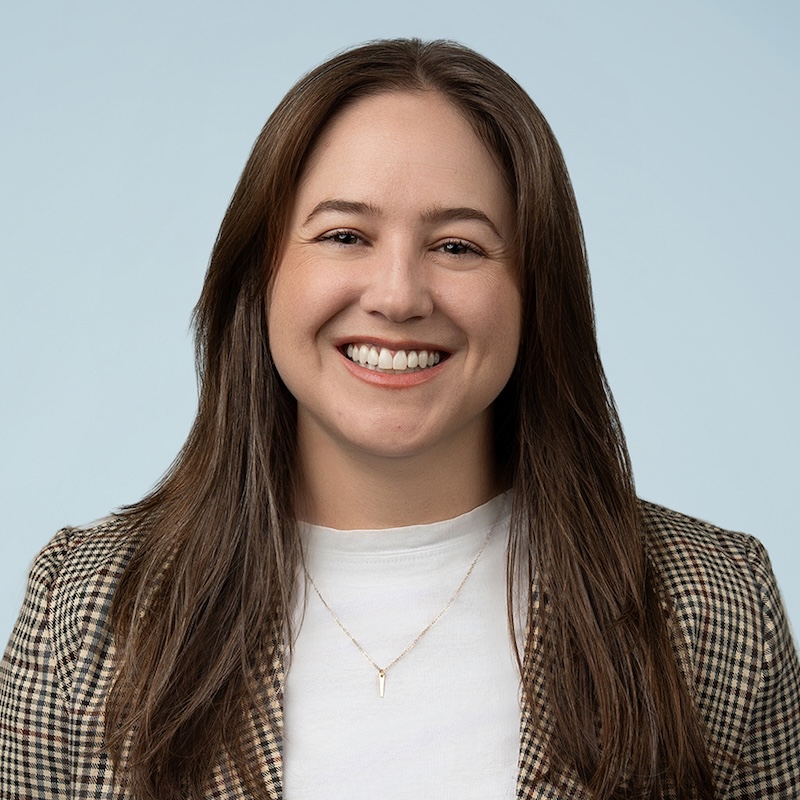 Woman in dark brown hair smiling