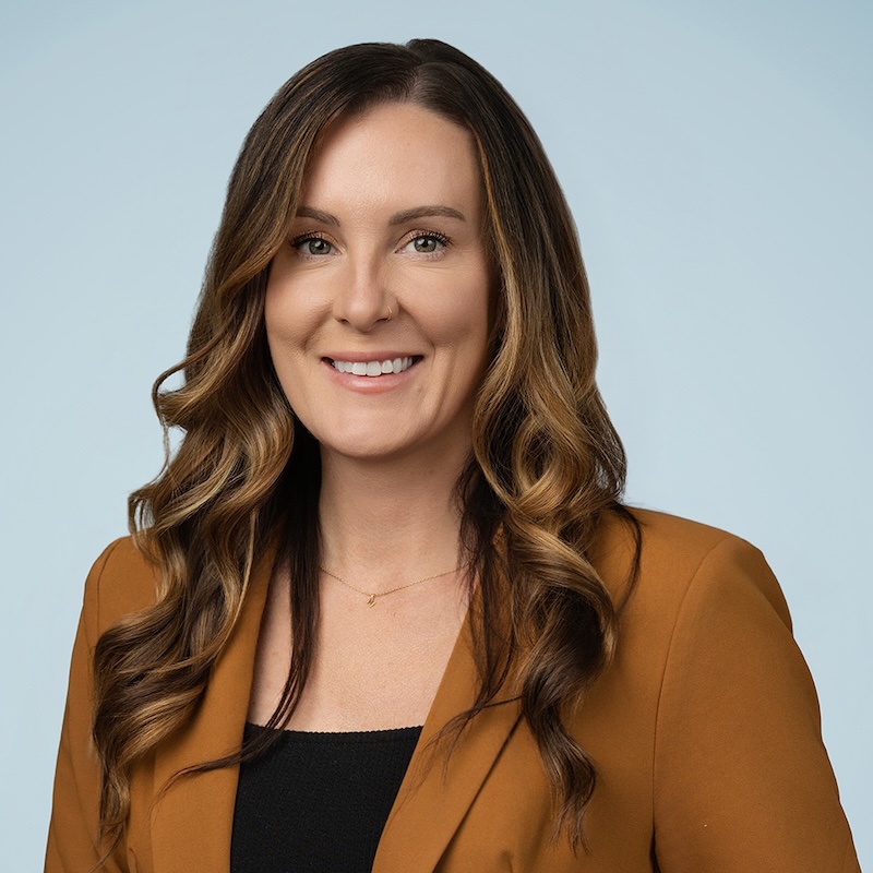 Women in long light brown hair smiling