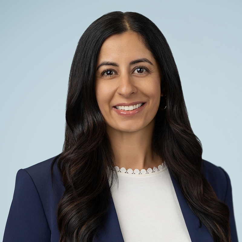 Woman in long black hair smiling