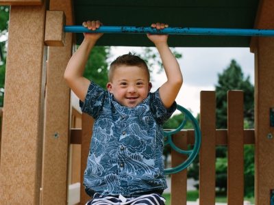 Boy smiling playing at the park